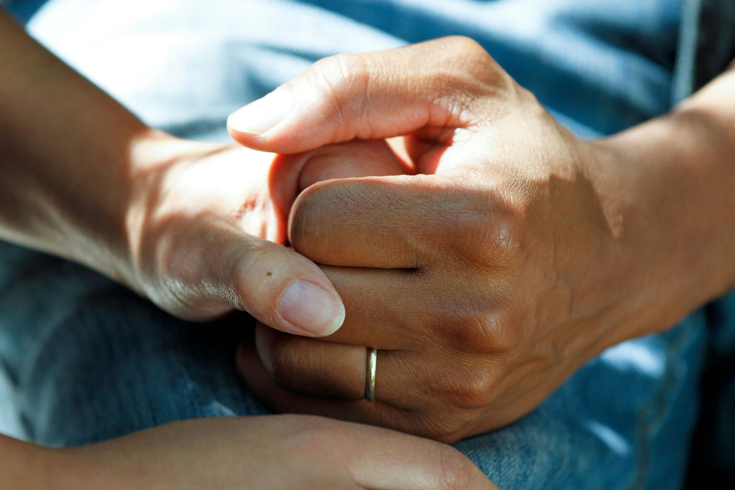 Two hands clasping